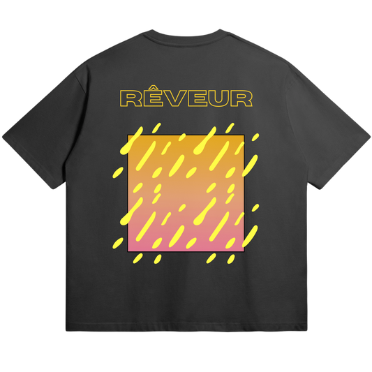 Oversized black streetwear t-shirt “SUNDRIP” by RÊVEUR — modern abstract design with yellow and pink gradient square and dripping shapes, minimalist and artistic style.