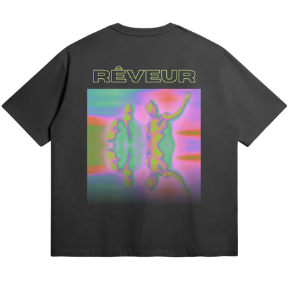 Oversized black streetwear t-shirt “HYPNAGOGIA” by RÊVEUR — abstract psychedelic art print in vibrant neon colors, blending dreamlike forms and creative expression.