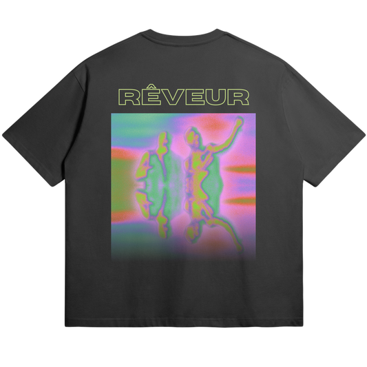 Oversized black streetwear t-shirt “HYPNAGOGIA” by RÊVEUR — abstract psychedelic art print in vibrant neon colors, blending dreamlike forms and creative expression.