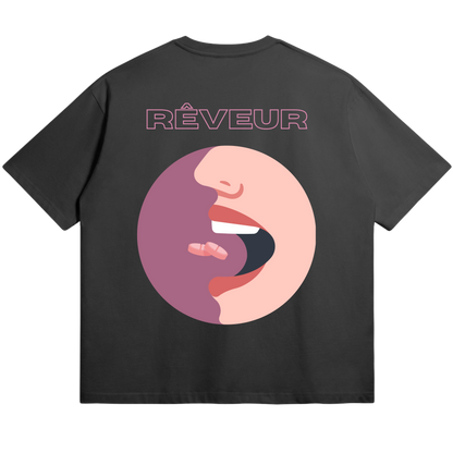 Oversized black streetwear t-shirt “MIND ENTRY” by RÊVEUR — minimalist artistic design featuring abstract lips illustration in pink tones on the back.