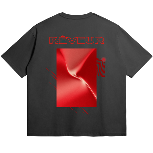 Oversized black streetwear t-shirt “RED SHIFT” by RÊVEUR — minimalist artistic design featuring a red metallic abstract rectangle on the back.