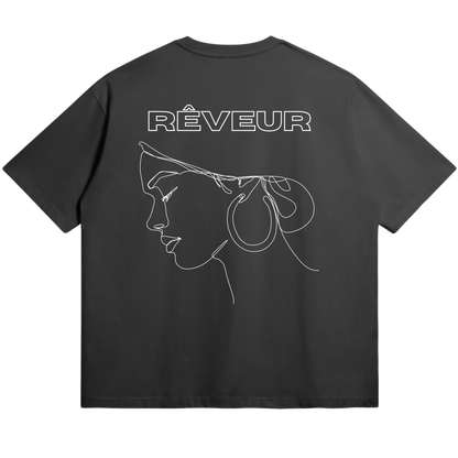 Oversized black streetwear t-shirt “SERENA” by RÊVEUR — minimalist line art design of a woman’s profile with hoop earrings, elegant and artistic style.