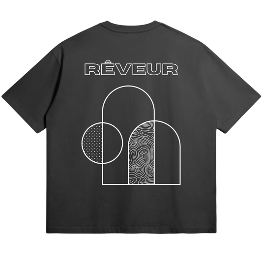 Oversized black streetwear t-shirt “TERRA ARC” by RÊVEUR — minimalist geometric line art with modern architectural shapes, clean and artistic streetwear design.